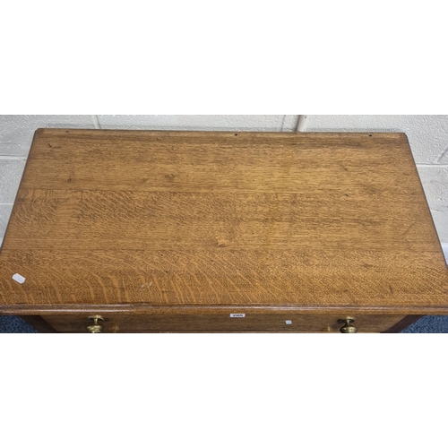 205 - AN EARLY 20TH CENTURY OAK  CHEST OF THREE LONG DRAWERS, raised on turned legs with castors, width 92... 