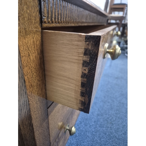 205 - AN EARLY 20TH CENTURY OAK  CHEST OF THREE LONG DRAWERS, raised on turned legs with castors, width 92... 