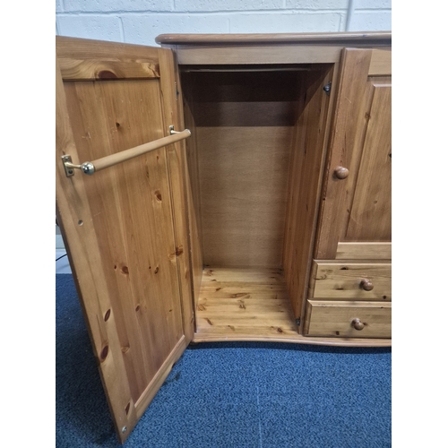 206 - A MODERN PINE LOW WARDROBE, with three cupboard doors and two drawers, raised on bun feet, width 142... 