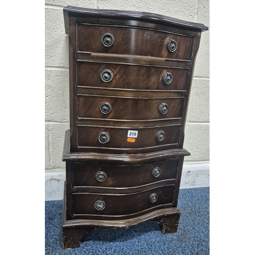 210 - A REPRODUCTION MAHOGANY SERPENTINE CHEST OF SIX DRAWERS, of small proportions, raised on bracket fee... 