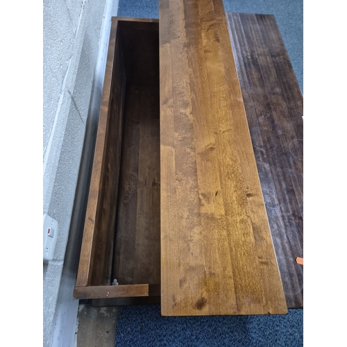 211 - A LAURA ASHLEY GARRAT DARK CHESTNUT COFFEE TABLE, with a bank of nine drawers and a hinged storage c... 