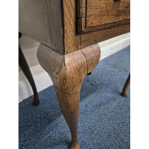 213 - A GEORGIAN OAK LOWBOY, fitted with a single frieze drawer, raised on cabriole legs, width 69cm x dep... 
