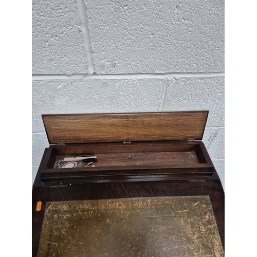 216 - AN EARLY 20TH CENTURY MAHOGANY DAVENPORT, with a small hinged compartment, a hinged leather writing ... 