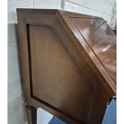 217 - A REPRODUCTION BUREAU, the fall front door enclosing a fitted interior, over a single drawer, raised... 