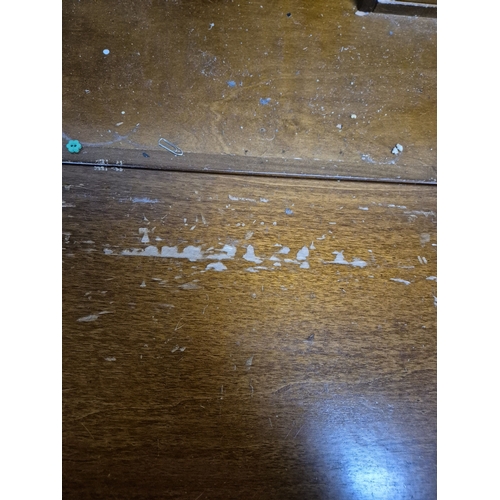 217 - A REPRODUCTION BUREAU, the fall front door enclosing a fitted interior, over a single drawer, raised... 