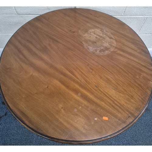 219 - AN EDWARDIAN MAHOGANY CIRCULAR CENTRE TABLE, raised on tapered supports and shaped legs, united by a... 