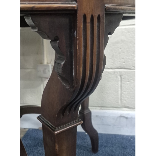 219 - AN EDWARDIAN MAHOGANY CIRCULAR CENTRE TABLE, raised on tapered supports and shaped legs, united by a... 