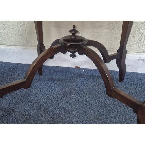 219 - AN EDWARDIAN MAHOGANY CIRCULAR CENTRE TABLE, raised on tapered supports and shaped legs, united by a... 