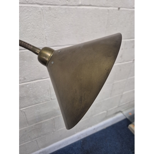 221 - LAURA ASHLEY, A BRASS STANDARD LAMP, with a cone shade and a flexible neck, on a circular stepped ba... 