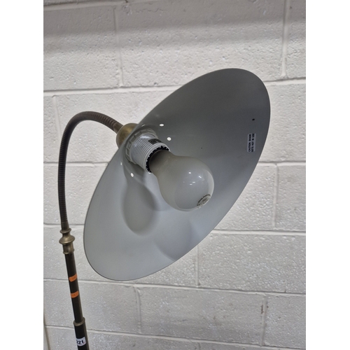 221 - LAURA ASHLEY, A BRASS STANDARD LAMP, with a cone shade and a flexible neck, on a circular stepped ba... 