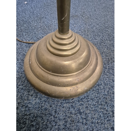 221 - LAURA ASHLEY, A BRASS STANDARD LAMP, with a cone shade and a flexible neck, on a circular stepped ba... 