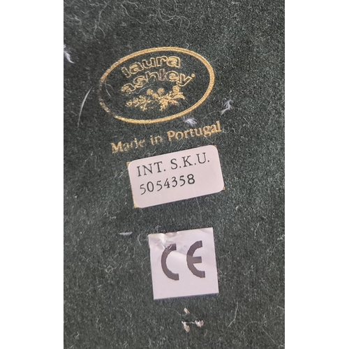 221 - LAURA ASHLEY, A BRASS STANDARD LAMP, with a cone shade and a flexible neck, on a circular stepped ba... 