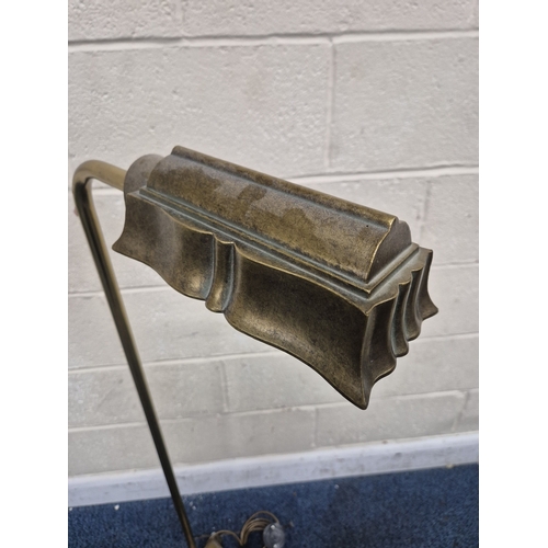 222 - LAURA ASHLEY, A BRASS STANDARD LAMP, with a moulded shade, raised on bracket-style feet, height 124c... 