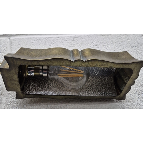 222 - LAURA ASHLEY, A BRASS STANDARD LAMP, with a moulded shade, raised on bracket-style feet, height 124c... 