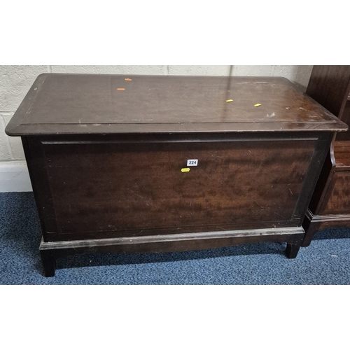 224 - A STAG MINSTREL BLANKET CHEST, width 97cm x depth 49cm x height 59cm, along with a bookcase, conditi... 