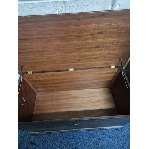 224 - A STAG MINSTREL BLANKET CHEST, width 97cm x depth 49cm x height 59cm, along with a bookcase, conditi... 