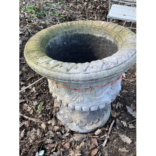 10 - A LARGE CONCRETE TWO-PIECE GARDEN URN with rope and swag detail to the balustered bowl and fluted ba... 