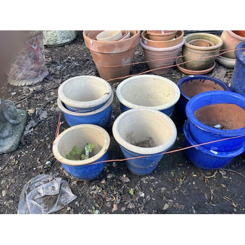 15 - TWELVE BLUE GLAZED PLANT POTS, of various shapes and sizes, the largest being 52cm high