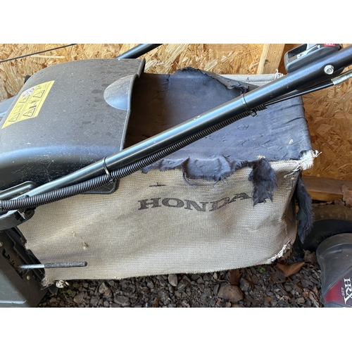 22 - A HONDA HRX 476 PETROL SELF-PROPELLED LAWNMOWER, with a grass box, condition report: engine turns fr... 