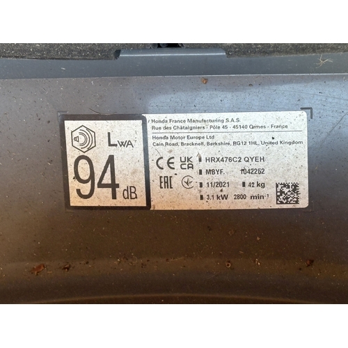22 - A HONDA HRX 476 PETROL SELF-PROPELLED LAWNMOWER, with a grass box, condition report: engine turns fr... 