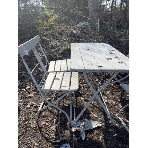 4 - A METAL FOLDING TABLE AND FOUR MATCHING CHAIRS with a wooden top, seats and backs, table width 100cm... 