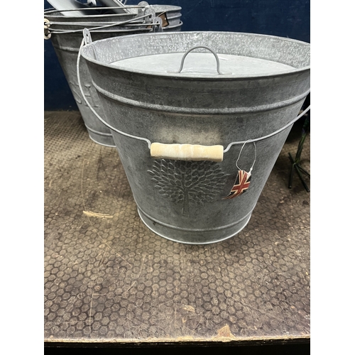63 - A COLLECTION OF METALWARE, including four east2eden galvanised metal ash bins with lids, three Woodl... 