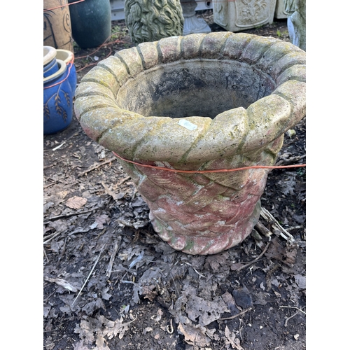 8 - FOUR PLANT POTS, including a concrete planter with lattice detail, 42cm in diameter, a pair of blue ... 