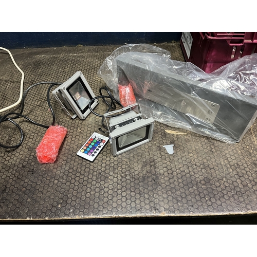 82 - A TRAY CONTAINING LIGHTING: including two LED remote control outside lamps, a vintage car lamp with ... 