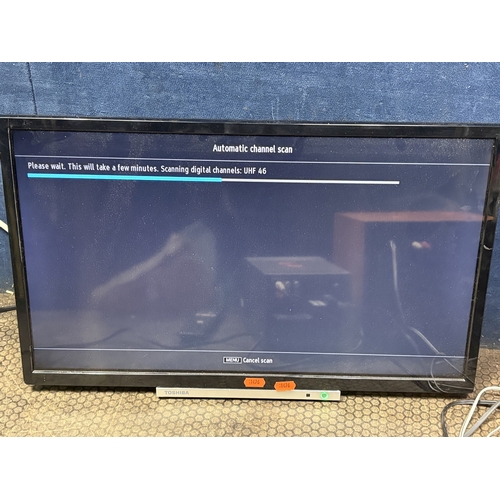 96 - A TOSHIBA 24'' LCD TV, with remote, along with a Sony hi-fi with two speakers, condition report: fau... 