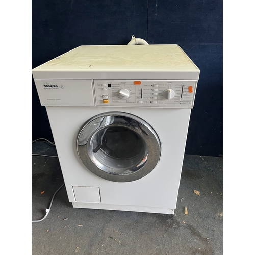 108 - A MIELE W945S WASHER DRYER, width 60cm, depth 60cm, height 85cm (PAT pass, spin cycle run but not te... 