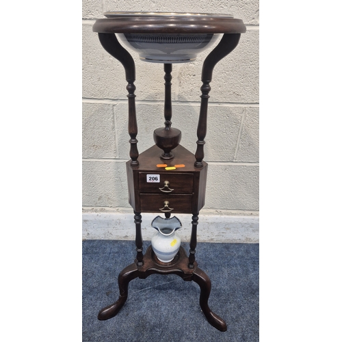 200 - A MAHOGANY WIG STAND, with a circular top, the triangle centre section with a lidded cup and two dra... 