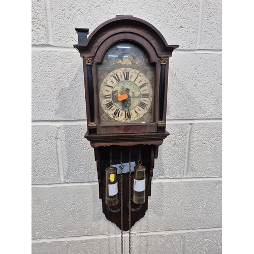 364 - TWO ZAANSE WALL CLOCKS, with brass figures holding a globe and raised gallery, one with two weights,... 