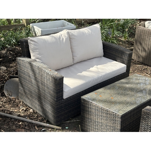 1 - A FAUX RATTAN FOUR-PIECE GARDEN SET, with loose cream cushions, comprising a two-seater settee, leng... 