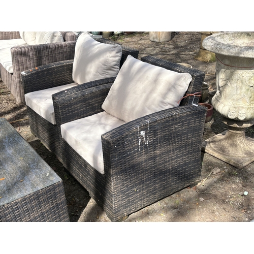 1 - A FAUX RATTAN FOUR-PIECE GARDEN SET, with loose cream cushions, comprising a two-seater settee, leng... 