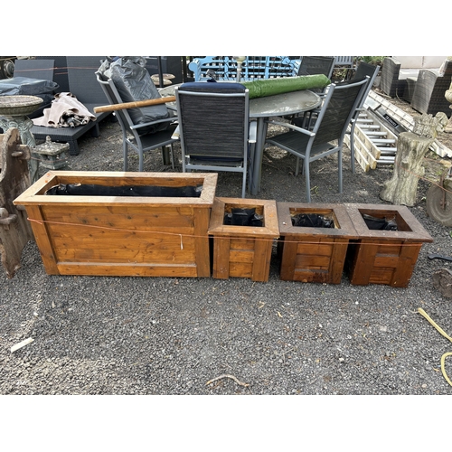 12 - A SELECTION OF STAINED PINE PLANTERS, including a single rectangular planter, width 100cm, and three... 