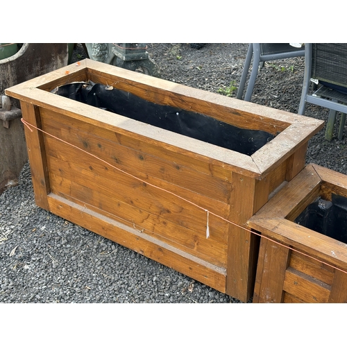 12 - A SELECTION OF STAINED PINE PLANTERS, including a single rectangular planter, width 100cm, and three... 