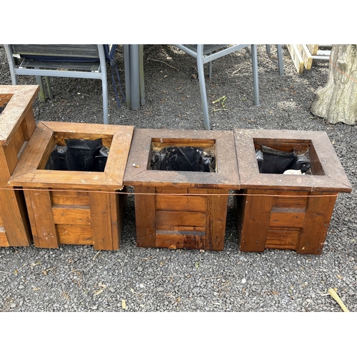 12 - A SELECTION OF STAINED PINE PLANTERS, including a single rectangular planter, width 100cm, and three... 