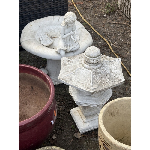 2 - A SELECTION OF GARDEN POTS AND ORNAMENTS, to include a mushroom-shaped bird bath with a girl sitting... 