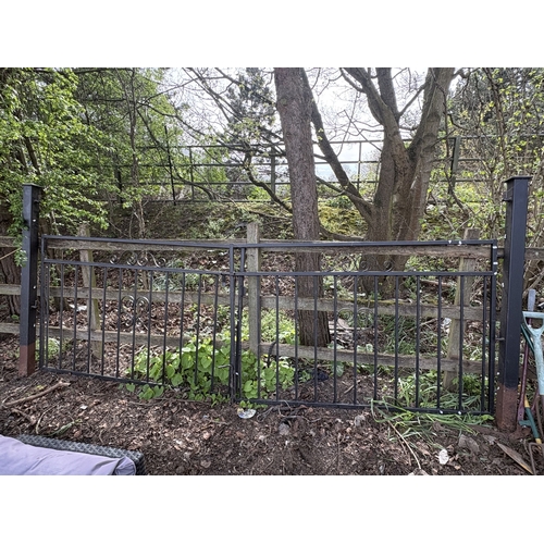 20 - A PAIR OF CAST METAL DOUBLE DRIVEWAY GATES, with posts, overall length between posts, 334cm, each ga... 