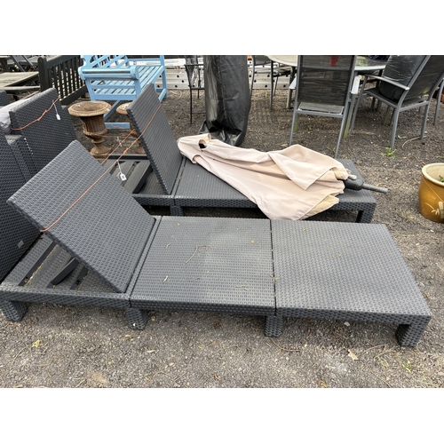 22 - ALLIBERT, A PAIR OF PLASTIC FAUX RATTAN ADJUSTABLE SUN LOUNGERS, along with a upop wind out parasol ... 