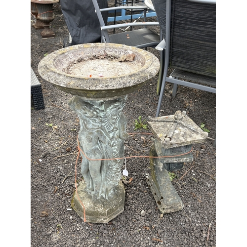 23 - A WEATHERED CONCRETE BIRD BATH, supported by three nude standing ladies and a religious figure, diam... 