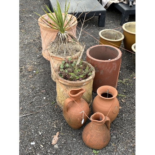25 - A SET OF THREE GRADUATED TERRACOTTA PLANT POTS, largest diameter 37cm x height 38cm, three terracott... 
