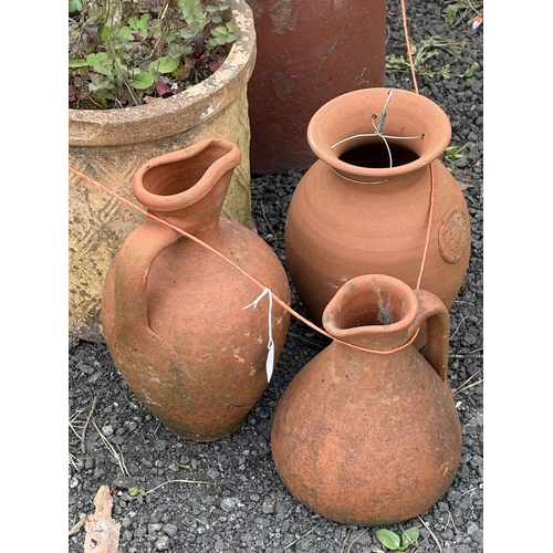25 - A SET OF THREE GRADUATED TERRACOTTA PLANT POTS, largest diameter 37cm x height 38cm, three terracott... 