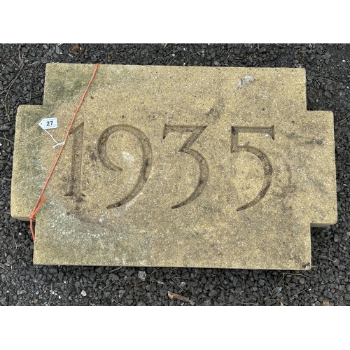 27 - A WEATHERED CONCRETE WALL STONE, carved with the year, 1935, 68cm x 44cm, condition report: appears ... 