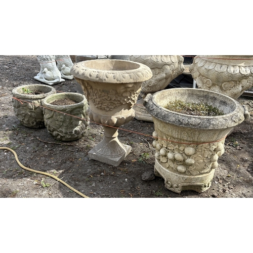 3 - FOUR VARIOUS WEATHERED CONCRETE GARDEN PLANTERS/URNS, to include an urn on a loose stand, diameter 4... 