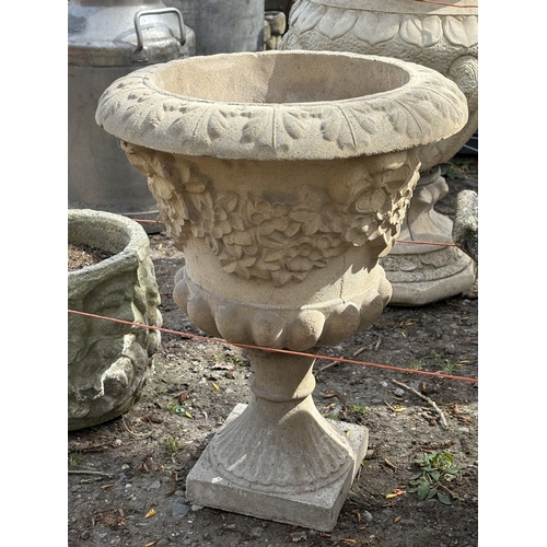 3 - FOUR VARIOUS WEATHERED CONCRETE GARDEN PLANTERS/URNS, to include an urn on a loose stand, diameter 4... 