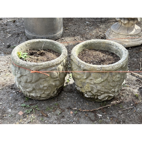 3 - FOUR VARIOUS WEATHERED CONCRETE GARDEN PLANTERS/URNS, to include an urn on a loose stand, diameter 4... 