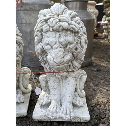 4 - A PAIR OF WHITE PAINTED CONCRETE GARDEN FIGURES, of seated lions, height 43cm, condition report: no ... 