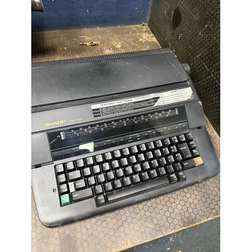 51 - A REMINGTON INTERNATIONAL TYPEWRITER, a sharp PA-3100S electric typewriter, a vintage Calor table fa... 