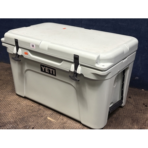 59 - A YETI 45 DUCK EGG HARD SHELL COOLER, with two baskets and ice packs, condition report: light scuffs... 